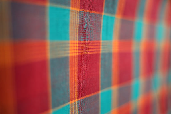 Checked patterns are commonly used in Chettinad Thari designs